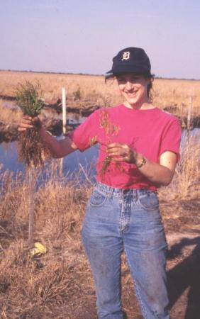 Laura Jull ( Michigan State University) holding seedlings